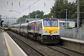 The 11.20 hrs service from Dublin Connolly to Belfast gathers speed at Clontarf Road Station, powered today by Translink / NIR engine 8208. 2019