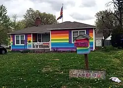 A house painted the colors of the LGBT pride flag