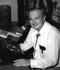 Eugene Shoemaker at a stereoscopic microscope