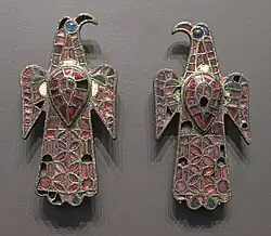 The Eagle-shaped fibulae of Alovera; 5th century; gold, bronze and glass (imitation of garnet); height: 11.8 centimetres (4.6 in), width: 5.9 centimetres (2.3 in); from Guadalajara (Spain); National Archaeological Museum (Madrid, Spain)
