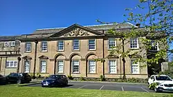 South front (1748 by Daniel Garrett). The pediment displays the Ord family coat of arms.