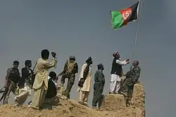 Flag raising over Khan Neshin castle, Rig District, after Operation Khanjar.