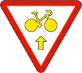 Bicycles are allowed to cross the red light for going straight