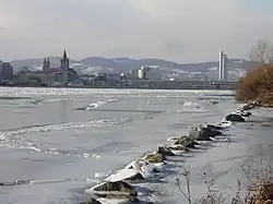 View upstream from the Donauinsel in Vienna, Austria during an unusually cold winter (February 2006), as the river rarely freezes there.[citation needed]