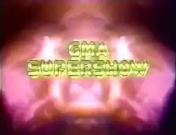 An image with a fainted red background. The show title is displayed on the center of the image.