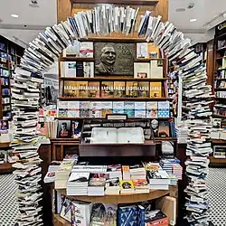 Geca Kon Bookstore interior in 2021 with the 1993 memorial plaque visible