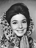 Graciela Borges, Argentine fashion icon of the 1960s, wearing a fur coat, bouffant hair and winged eye liner