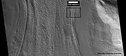 Context picture showing origin of next picture. The location is a region of lineated valley fill. Image from HiRISE under HiWish program.