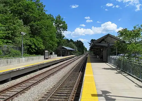 A railway station with two high-level platforms flanking two tracks