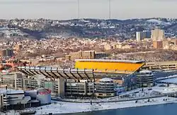 Heinz Field on the North Shore, with the Ohio River visible in the foreground and the Kamin Science Center to the left.