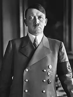 Black-and-white photographic portrait of Hitler standing