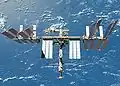 The newly upgraded International Space Station seen from the shuttle after undocking.