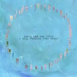 On a blue background, a circle of pixelated brown rectangles with the band and single names in the center