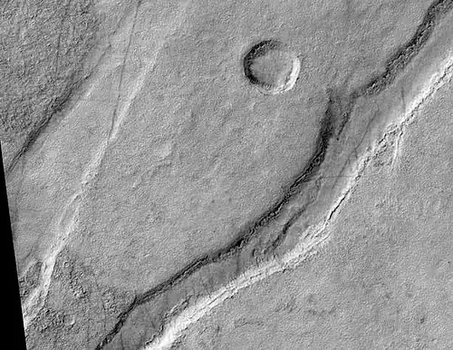 Icaria Fossae Graben, as seen by HiRISE. Click on image for a better view of Dust Devil Tracks.