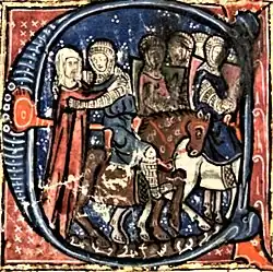 A man riding a horse embraces a woman, with other knights in the background