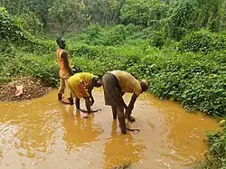 "Illegal Gold mining Nigeria1" by Dame Yinka is licensed under CC BY-SA 4.0.