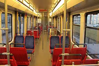 Interior of an S2 train with padded seating and bicycle racks