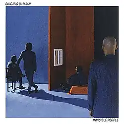 A person staring at another person looking through a window watching two people stare at a wall