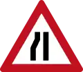 Road narrows from left ahead