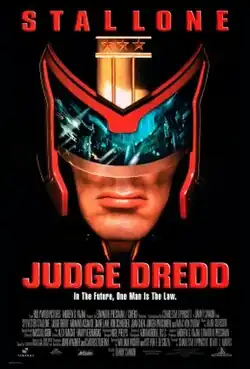 A headshot picture of Judge Dredd, wearing his helmet and with a view of Mega City One inside his glasses of the helmet. Below him there are the film's slogan, title, credits and release date.
