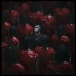 KSI standing among a crowd of copies of Trippie Redd.