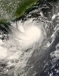 The image shows Typhoon Kalmaegi shortly before being upgraded to a typhoon on July 17 in the Pacific Ocean. Taiwan is visible to the left side.