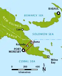 Colour map depicting the location of the Kokoda Trail within New Guinea. The country is wide in the west, on the left of the map and narrows to a peninsula in the east on the right of the map. The Kokoda Trail stretches from Port Moresby on the southern coast to the village of Kokoda