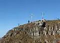 Two Christian crosses on the summit.