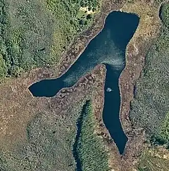 Satellite image of a lake in the shape of a v