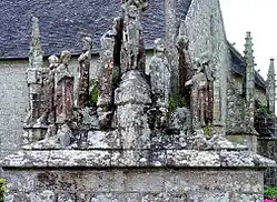 The south face of the Quilinen calvary. Various apostles stand around the pedestal's platform.