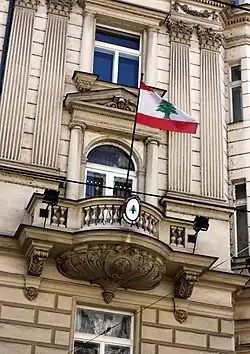 The flag of Lebanon flying over the Embassy of Lebanon in Prague