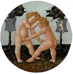 Verso, as last. Two toddlers engage in no holds barred wrestling