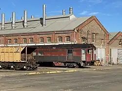 Locomotive-hauled car BM259 (former Bluebird railcar 259 ‘Penguin’) stored at Islington Railway Workshops awaiting conversion to a crew car, July 2023.