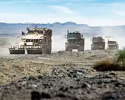 In convoy, an M-ATV with mine roller attachment) and two MTVRs with TerraMax. The third MTVR is manned.