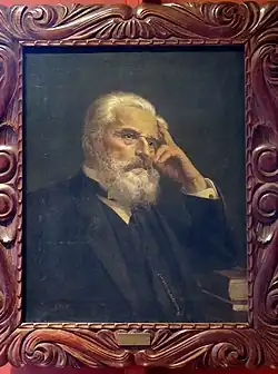 A portrait of José Joaquín Rodríguez, with a white beard and his hand at his temple
