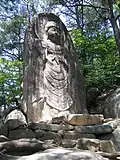 The carved image of the standing Buddha (마애불입상) on Gayasan, Hapcheon, South Korea.