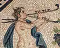 Circa 220 A.D, Cologne, Germany (former Roman Empire). Image of a maenad playing a tibia curva as part of a pair of tibia. Dionysosmosaik "Römisch-Germanisches Museum", Cologne, Germany.