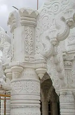 Intricate carving on a marble pillar