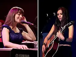 Marion Raven, a young brunette woman, playing a guitar on stage