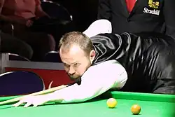 Mark Joyce playing a shot from the baulk end.