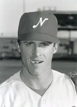 A black and white photograph of a baseball player