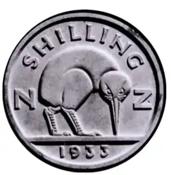 A model of a New Zealand shilling design. An abstract kiwi is facing towards the viewer, beak pointed towards the ground. The letters "N" and "Z" are behind and to the left and right of the bird, respectively. Below a flat ground-line is the date, 1933, while arcing above is the text "SHILLING".