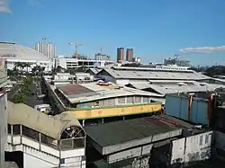 A view of the Farmers Market at the foreground from the Araneta Center–Cubao MRT station (2014)