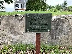 A milestone in Yarmouth, Maine, on the Boston-to-Machias "King's Highway" route. The milestone, now incorporated into a wall, is engraved with "B 138," to denote its distance of 138 miles from Boston