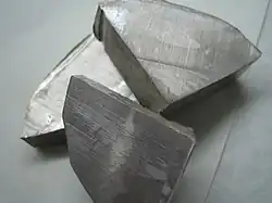 Three large pieces of silvery metal
