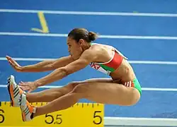 Image 16Naide Gomes in the jumping phase of the event (from Track and field)