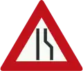 J18: Road narrows on the right side