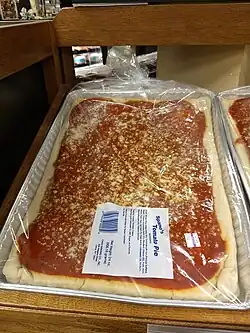 Italian tomato pie for sale in a grocery store near Utica, New York