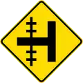 Railway level crossing on side road to left