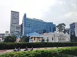 Ho Chi Minh Stock Exchange Tower (Blue) with ROX Tower (Left; originally Maritime Bank Tower then TNR Tower)
